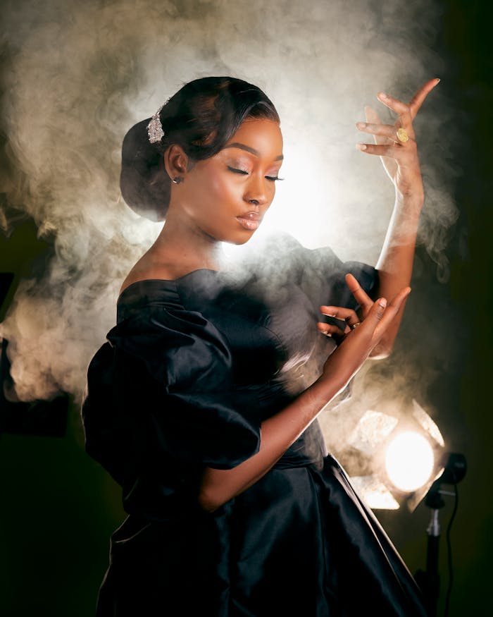 elegant-woman-posing-amidst-dramatic-smoke-30743679